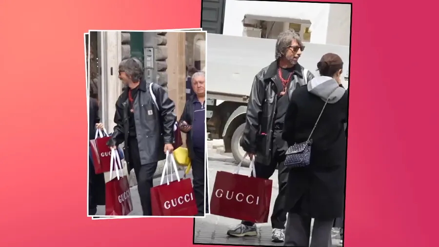 Pierpaolo Piccioli se pasea con bolsas Gucci frente a una tienda de Valentino