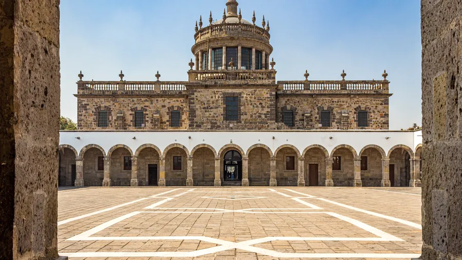 Building,Facade,In,Central,Patio,In,Hospicio,Cabañas,Against,Blue