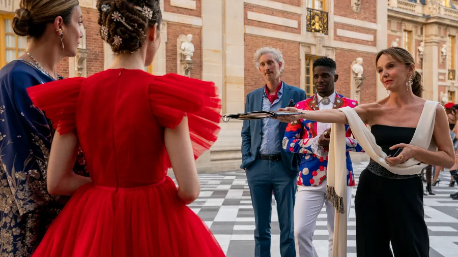 Emily in Paris. (L to R) Kate Walsh as Madeline, Lily Collins as Emily, Bruno Gouery as Luc, Samuel Arnold as Julien, Philippine Leroy-Beaulieu as Sylvie Grateau in episode 210 of Emily in Paris. Cr. Stéphanie Branchu/Netflix © 2021
