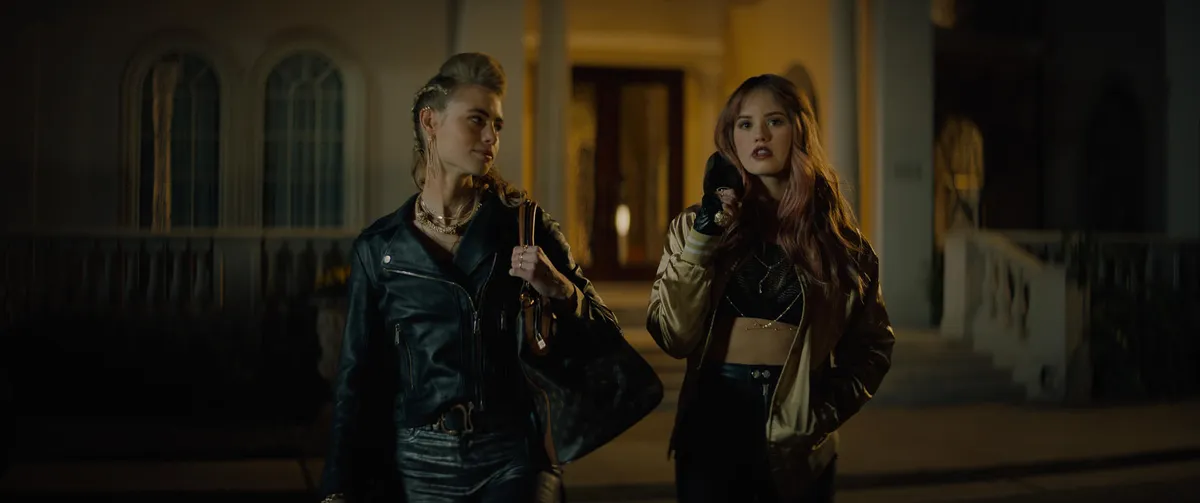 NIGHT TEETH (2021). Lucy Fry as Zoe and Debby Ryan as Blaire.