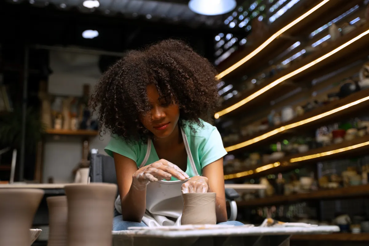 African,Woman,Make,Earth,Ware,At,Workshop.,Small,Business,,Hobbies.