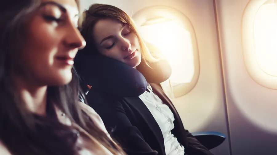 Girlfriends,Traveling,By,Plane.,A,Female,Passenger,Sleeping,On,Neck