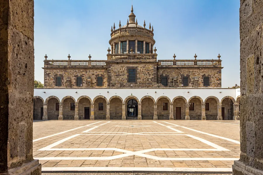 Building,Facade,In,Central,Patio,In,Hospicio,Cabañas,Against,Blue
