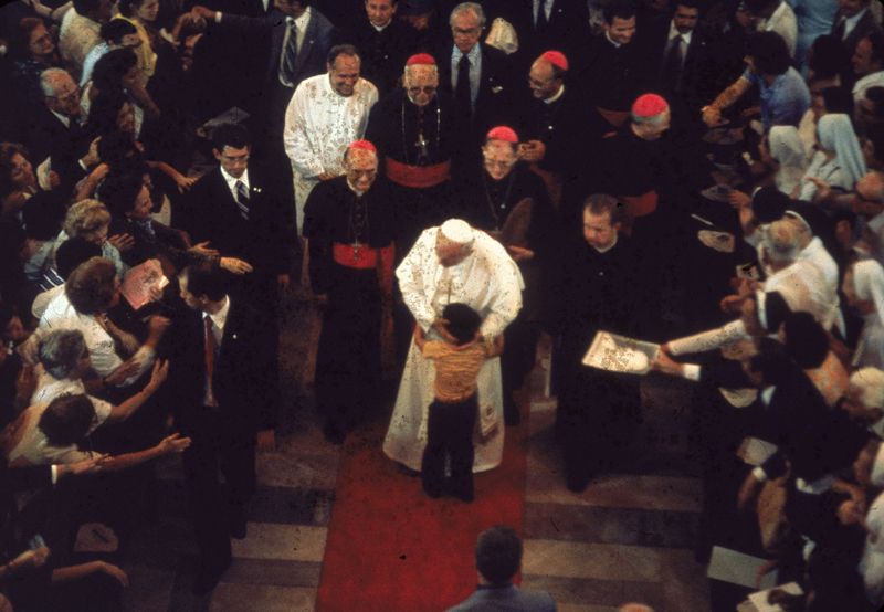 John Paul II Embraces Child