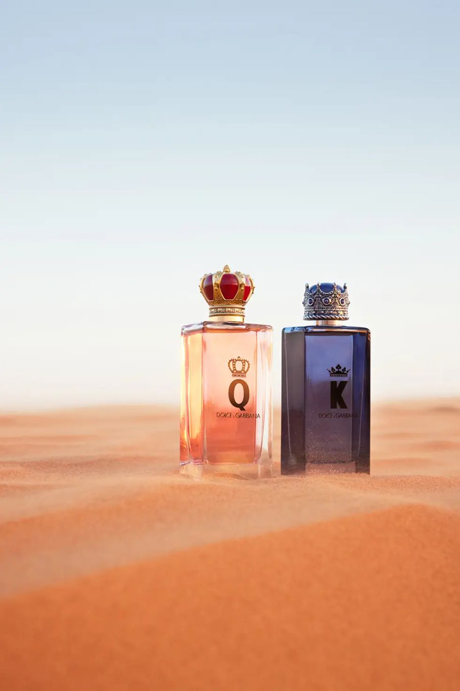 bottles of dandg kandq fragrances on sand