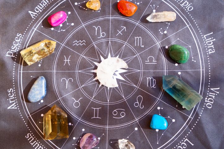 Healing crystals on brown background