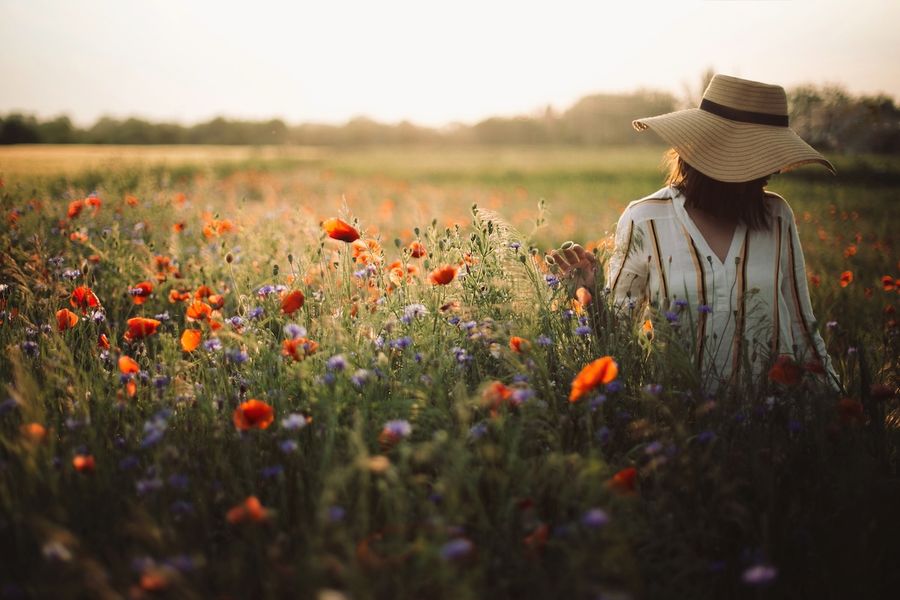 Stylish,Woman,In,Rustic,Dress,And,Hat,Walking,In,Summer